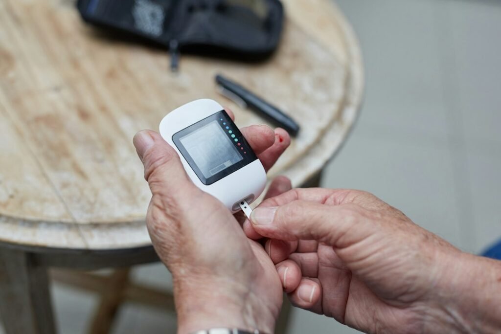 Applying a CGM sensor patch to the arm