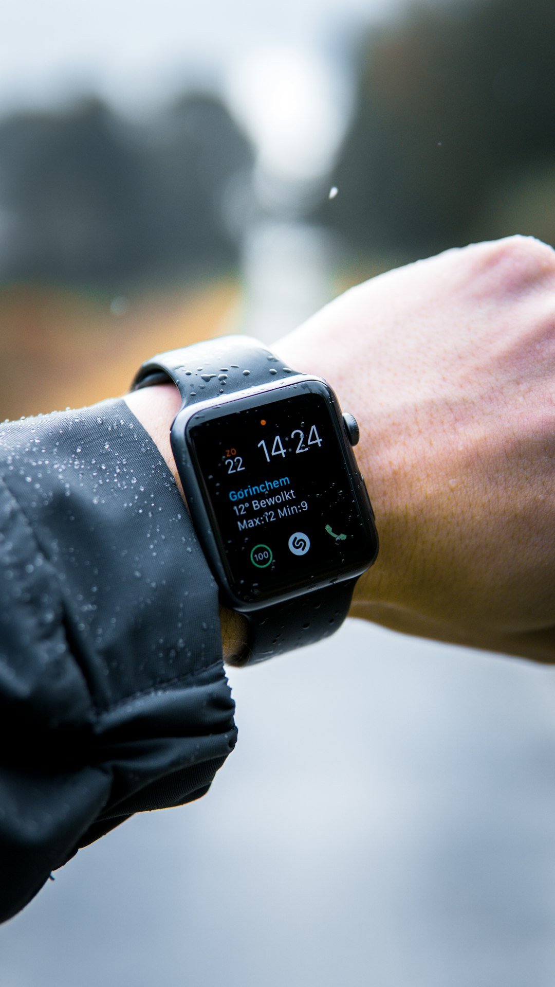 Person checking glucose data on a smartwatch