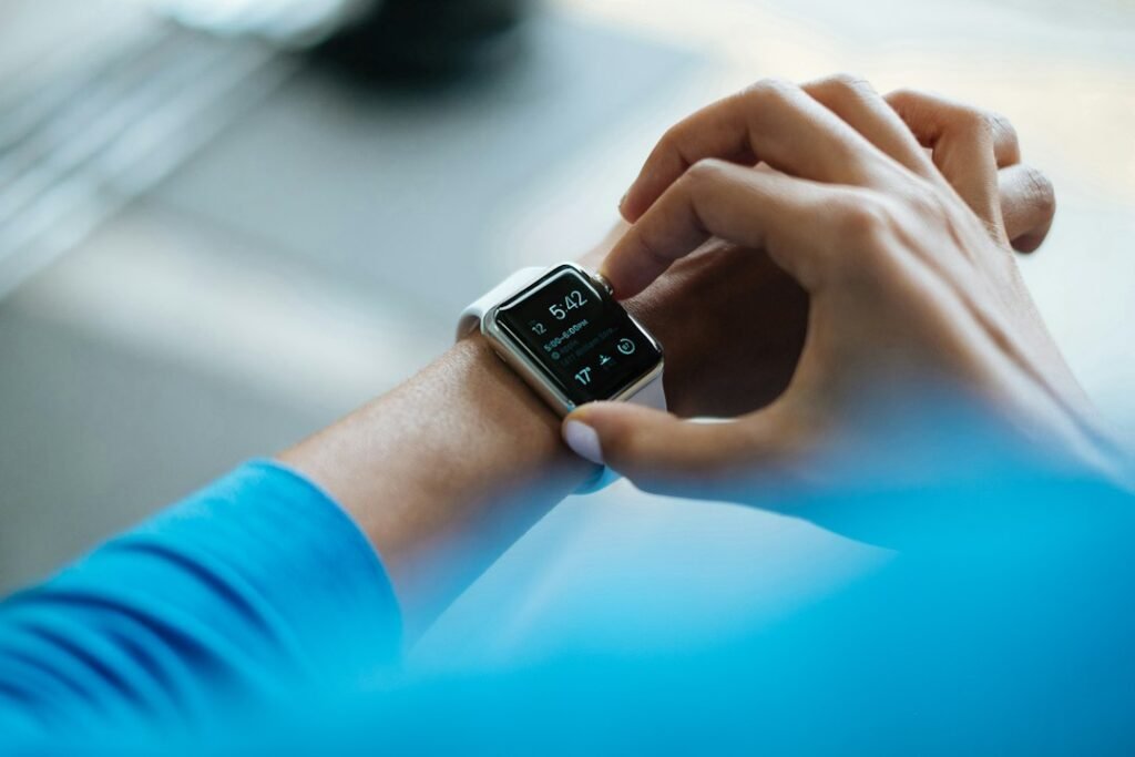 Person checking heart rate data on a smartwatch