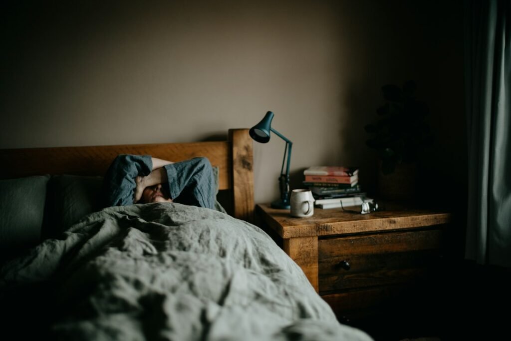 Person sleeping under a blanket for deep sleep tracking