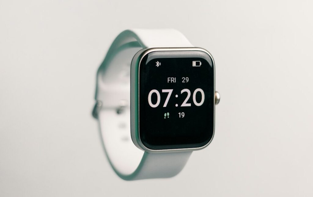 Smartwatch next to a glucose testing device