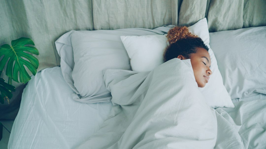 Woman sleeping peacefully at night, relevant to sleep apnea detection