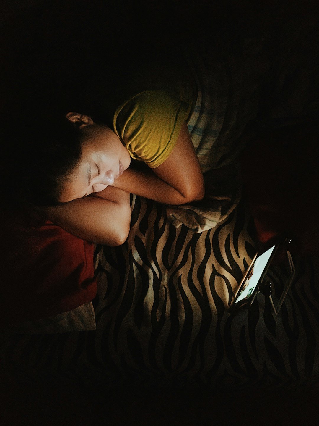 Person sleeping while wearing a sleep tracker