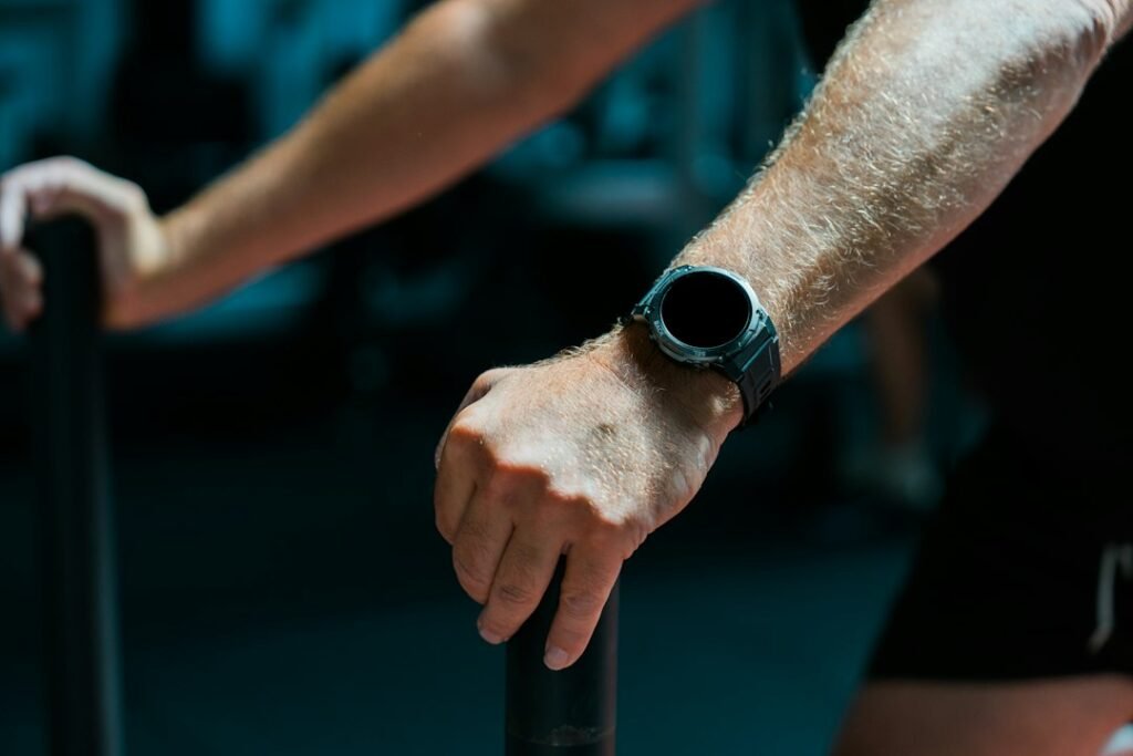 Close up of a person wearing a fitness tracker on their wrist