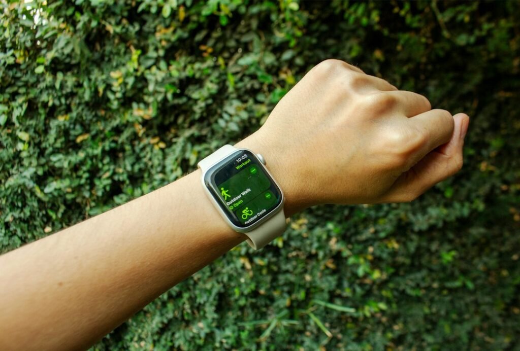 Person wearing a smartwatch outdoors