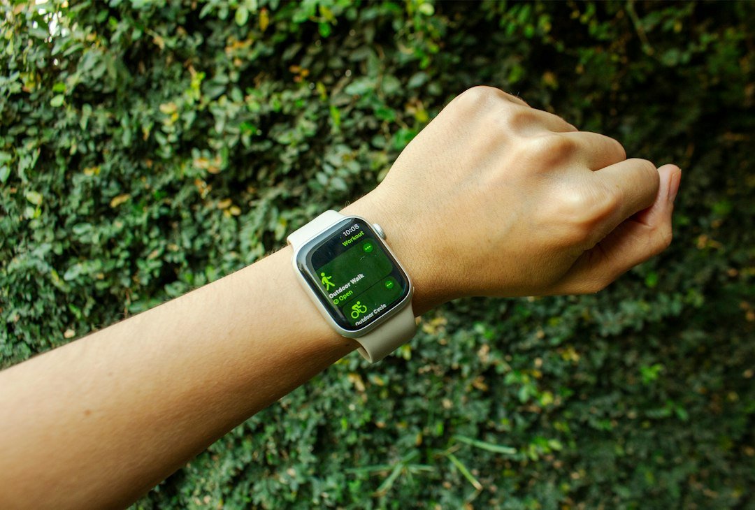 Person wearing a smartwatch outdoors